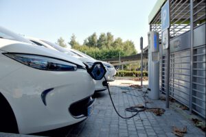 Electric Vehicles Charging at a Station, by Stivabc, found on https://pixabay.com/photos/parking-space-car-electric-car-1678181/
