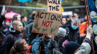 Sign Reading "Actions, not Blah Blah Blah"