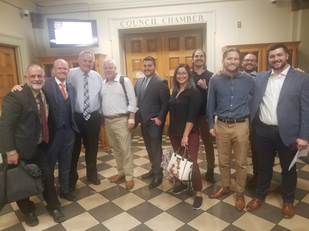 From left to right: Woody Hastings (The Climate Center), Nick Chaset (CEO, EBCE), Dan Wright (Stockton City Councilmember), Scott Haggerty (Alameda County Supervisor), Dan Arriola (Tracy Councilmember), Alicia Valenzuela (Stockton Chai), Jonathan Pruitt (Catholic Charities), Davis Harper (Edge Collaborative), Alex DiGiorgio (EBCE), and Grant Kirkpatrick (Stockton city staff).