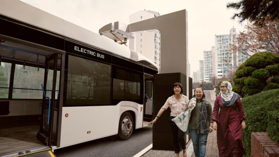 Electric city bus and pedestrians