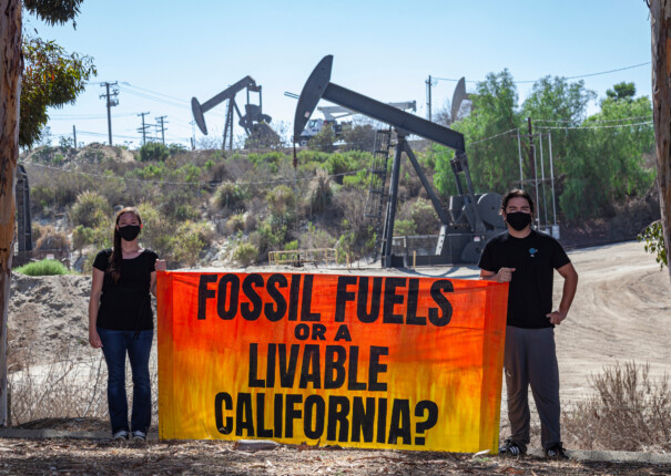 Activists gather near an Inglewood Oil Field in Los Angeles, one of the largest contiguous urban oil fields in the country, to urge the Governor of California to take action to phase out fossil fuels, beginning with those within 2500 feet of homes and other sensitive sites.