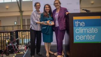 The Climate Center CEO Ellie Cohen (left) and Senate President pro Tempore Monique Limón (center), present Senator Eloise Gómez Reyes (right) with the 2026 California Climate Leadership Award. Photo by Lara Aburamadan / Survival Media Agency.